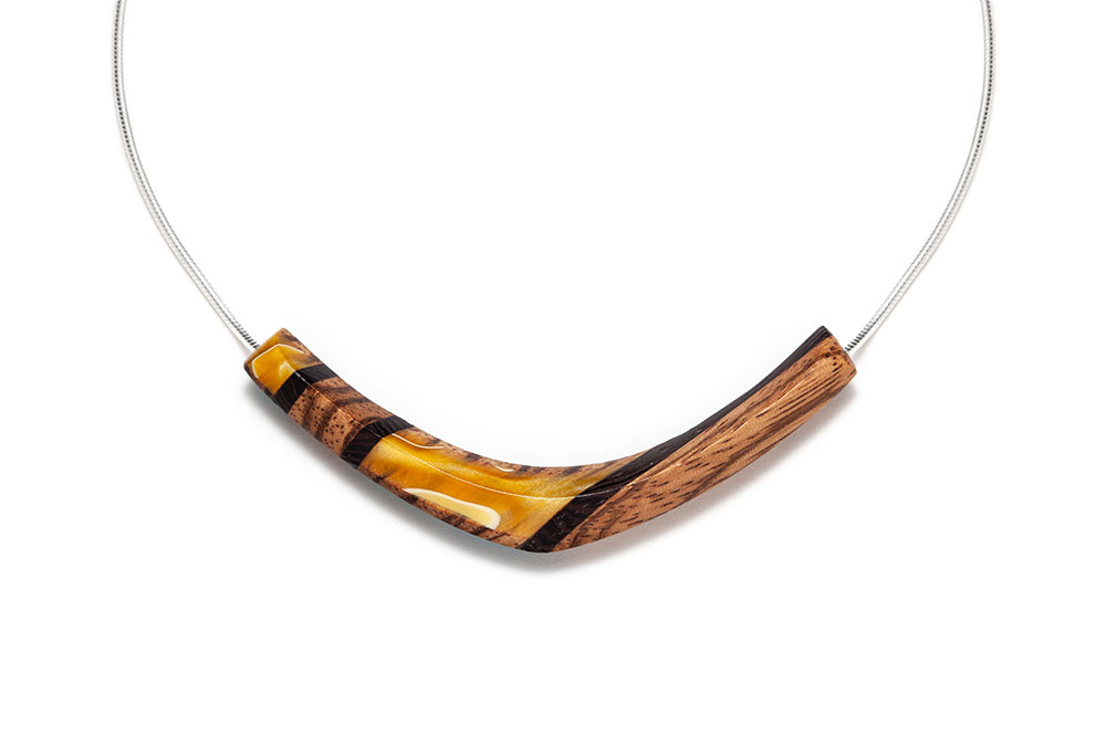 Yellow wooden necklace on silver chain